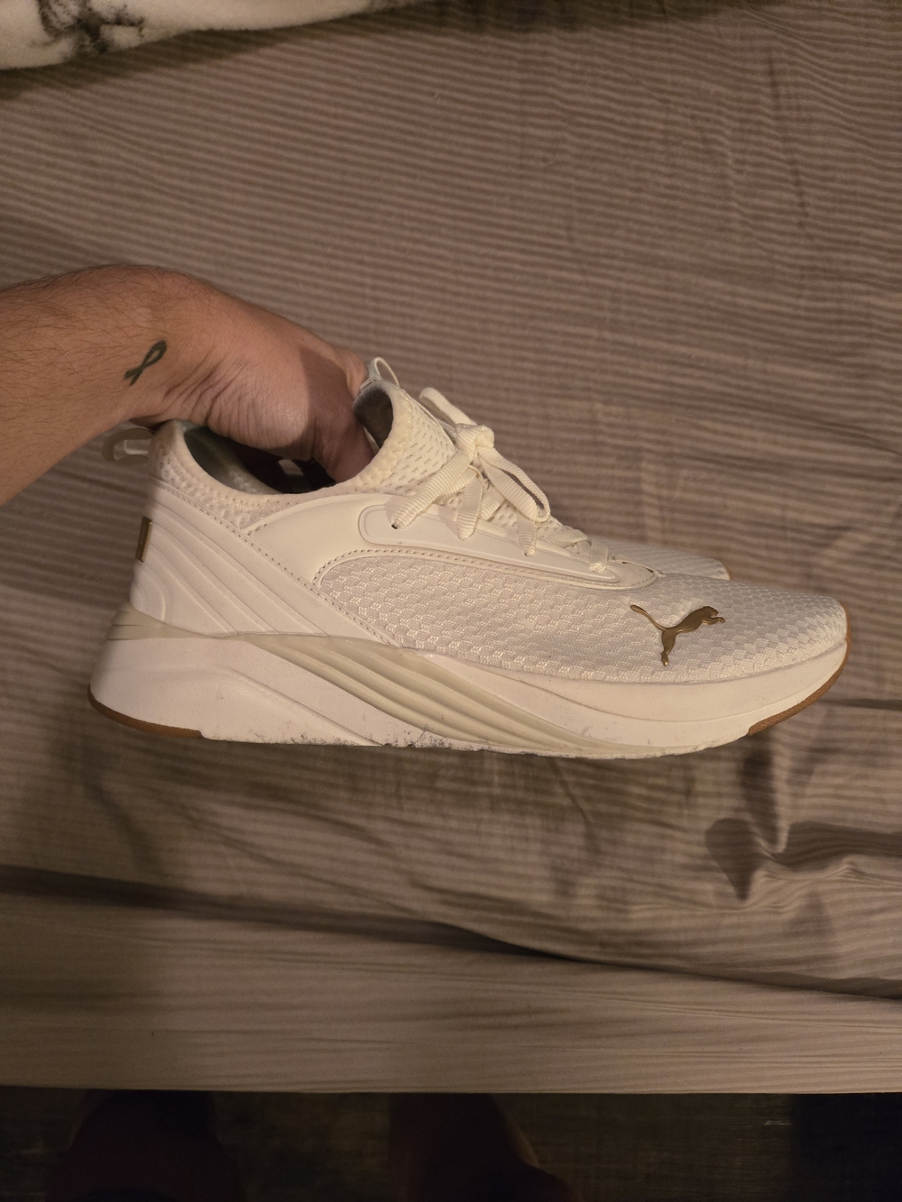 Puma Women's White Sneaker with Gold Logo Accent